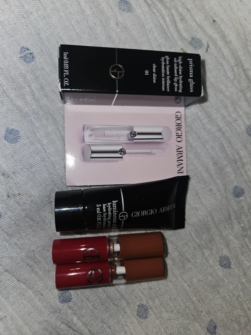 4 Giorgio Armani;  2 Lip in Venetian Red, gloss and primer.